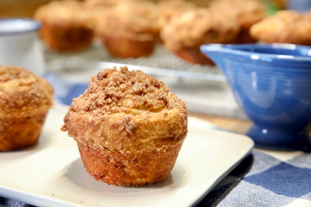 Cinnamon sugar croissant muffins on a small plate.