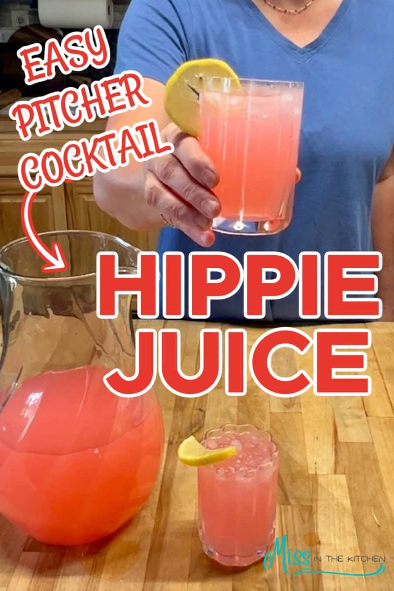 Woman with glass of hippie juice cocktail, pitcher and another glass.