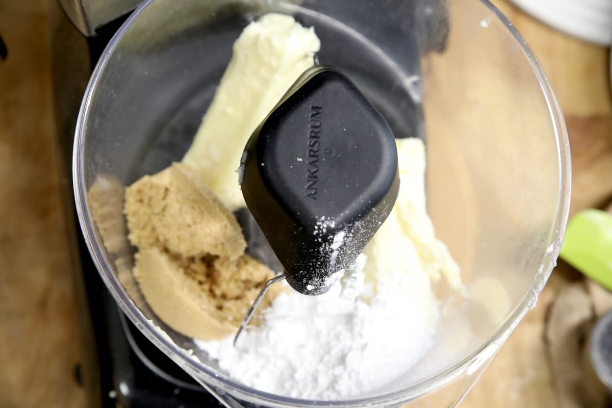 Mixer bowl with sugar and butter for cookies.