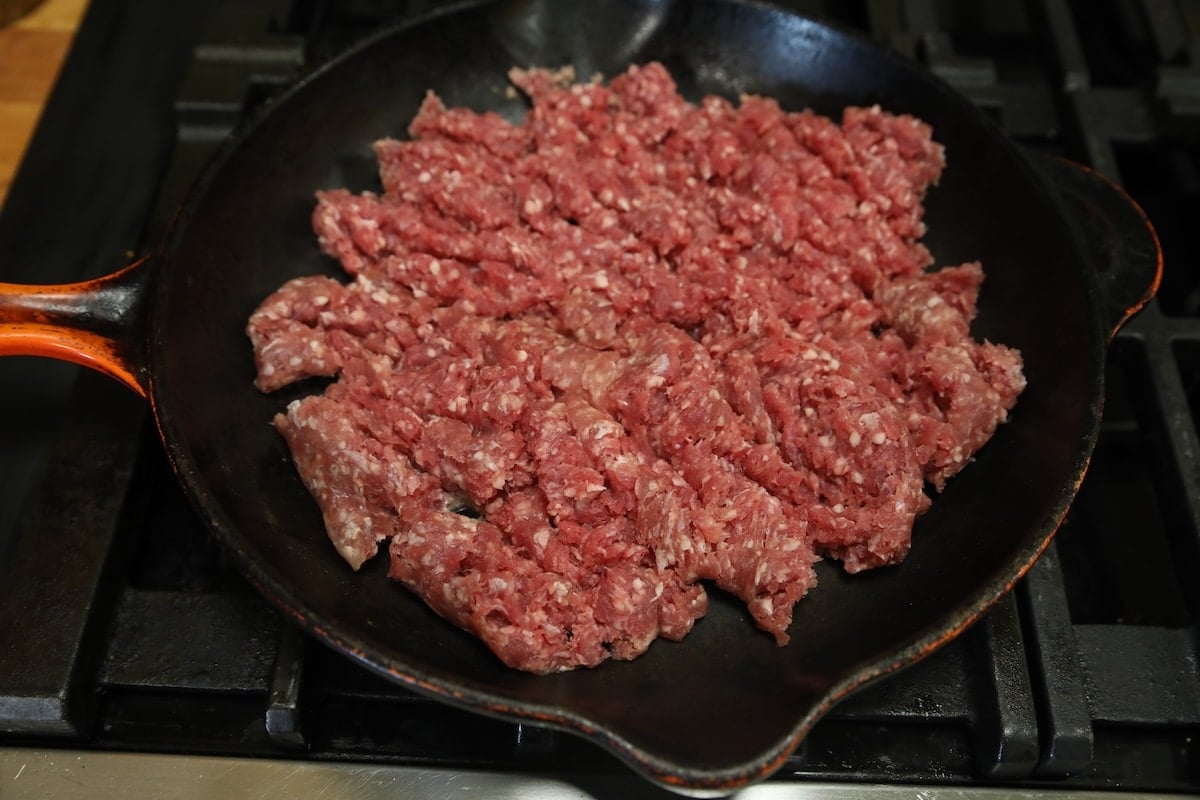 Ground beef in a skillet.