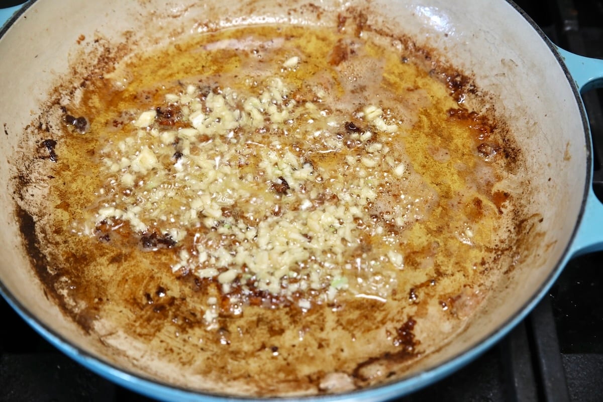 Minced garlic in a skillet with olive oil and butter.