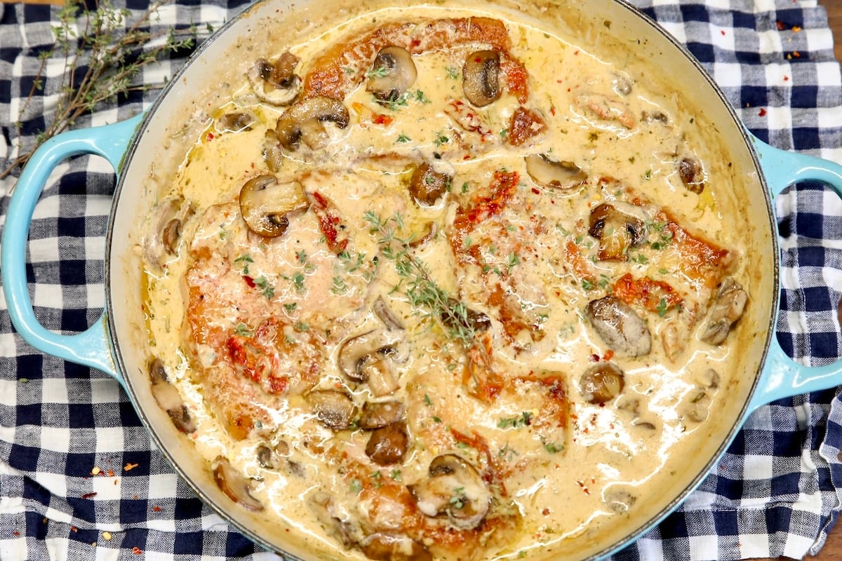 Pork chops in Italian cream sauce. Marry me pork chops in a pan with mushrooms and cream sauce.