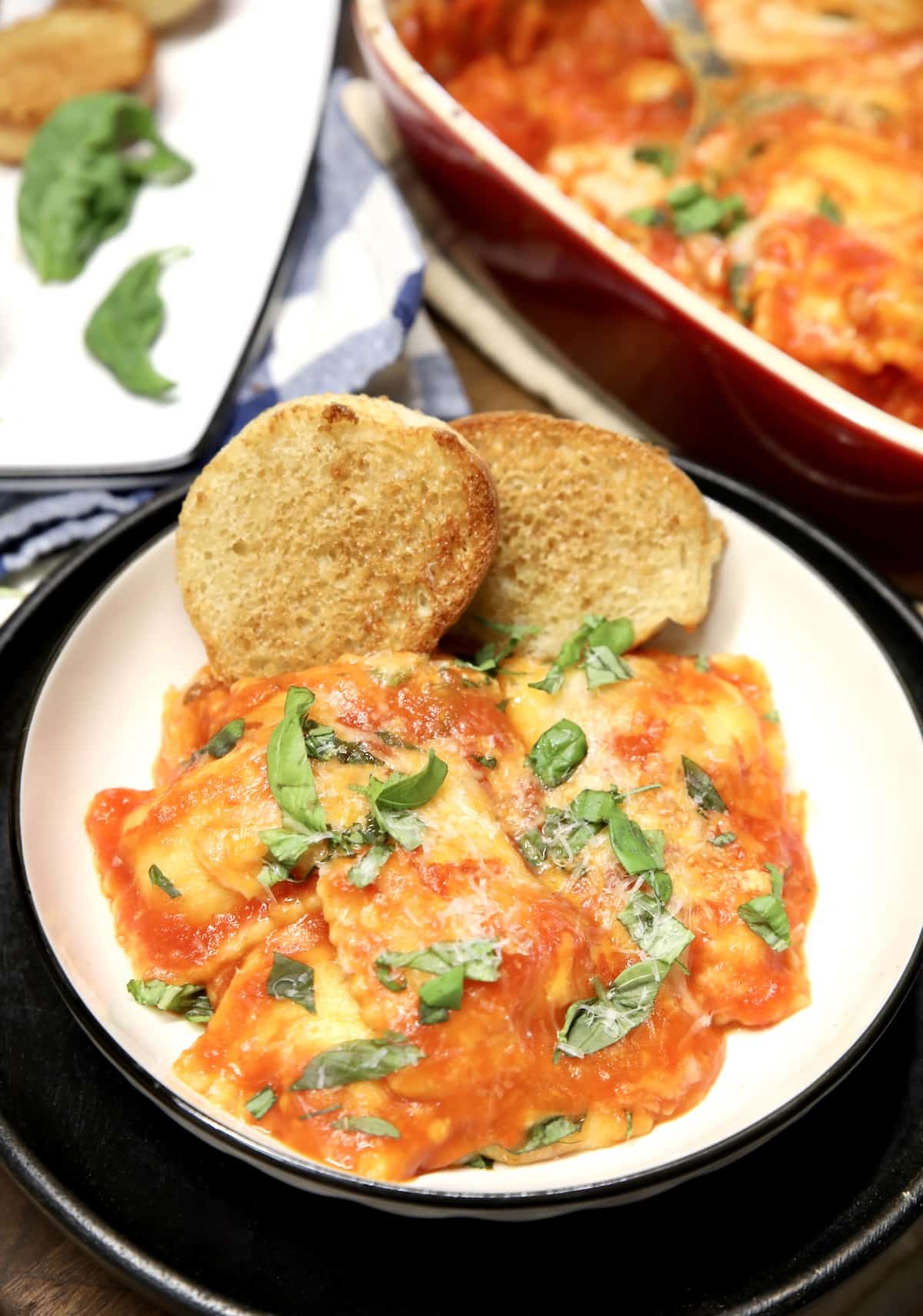 Plate of ravioli with garlic bread.