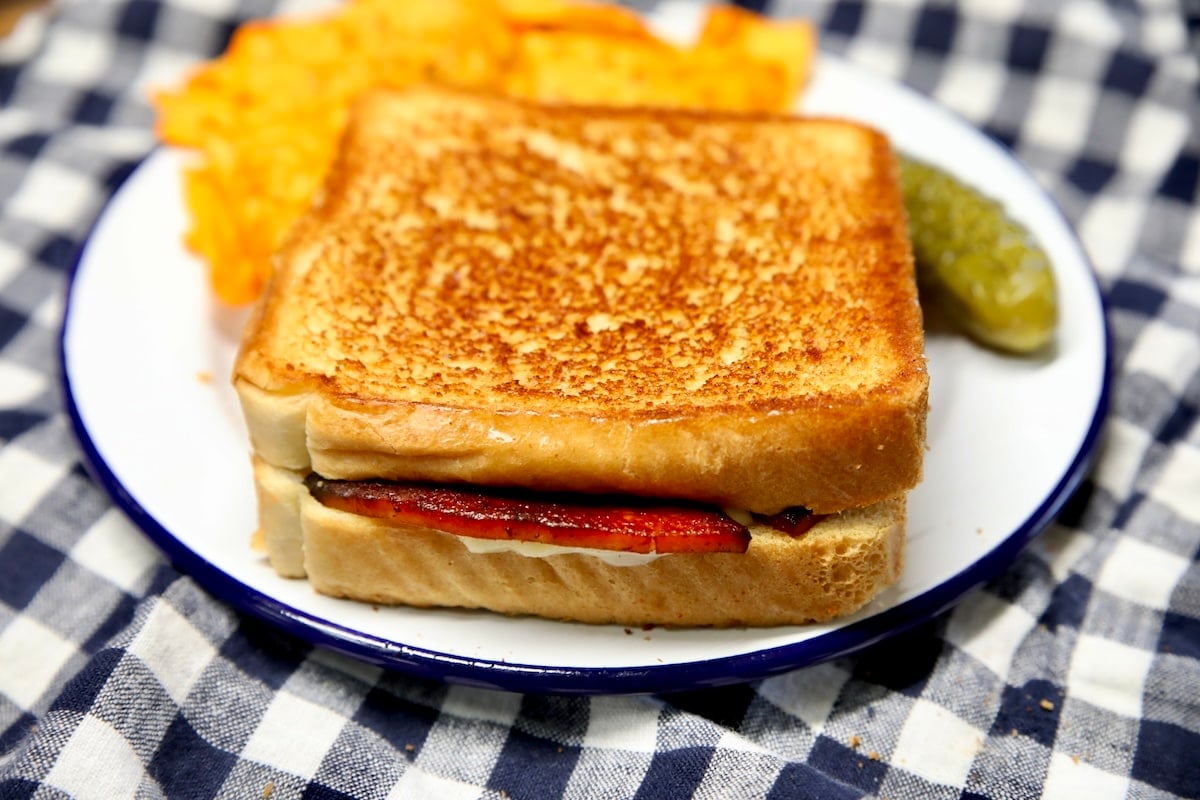 Bologna Grilled cheese with a pickle on top.