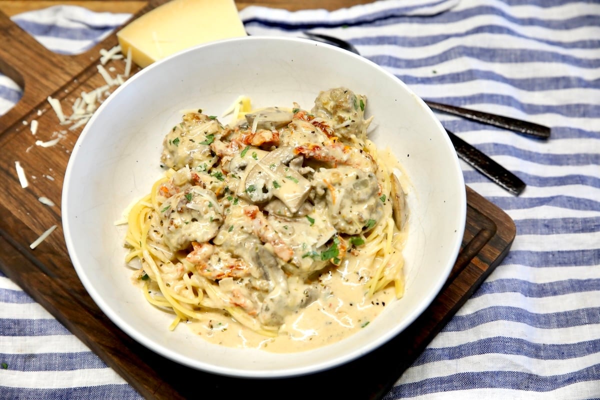 Meatballs with mushroom cream sauce. Meatballs with creamy mushrooms sauce over spaghetti.