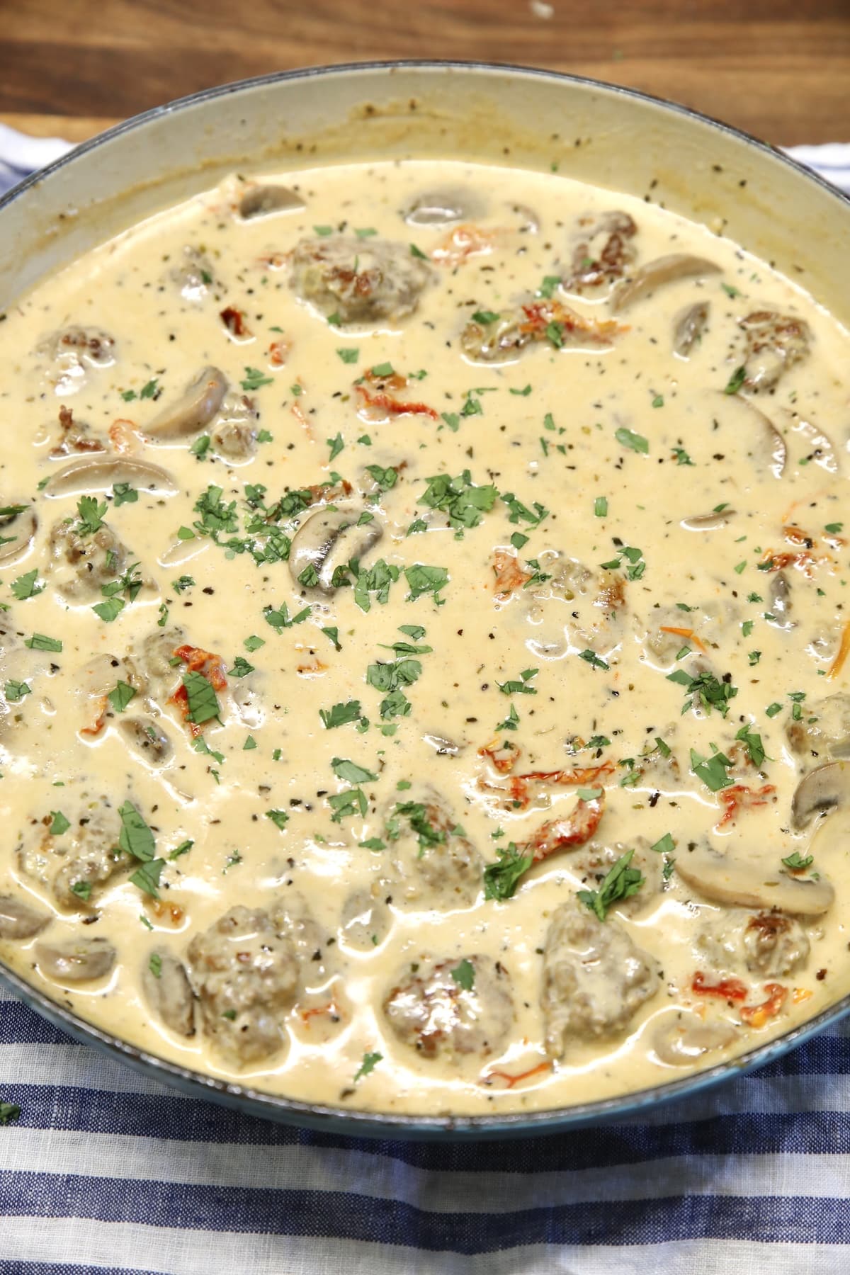 Pan of marry me meatballs with creamy sun dried tomato sauce.