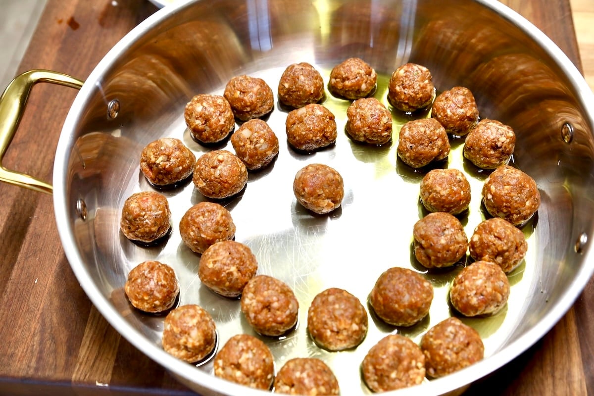 Meatballs in a skillet.