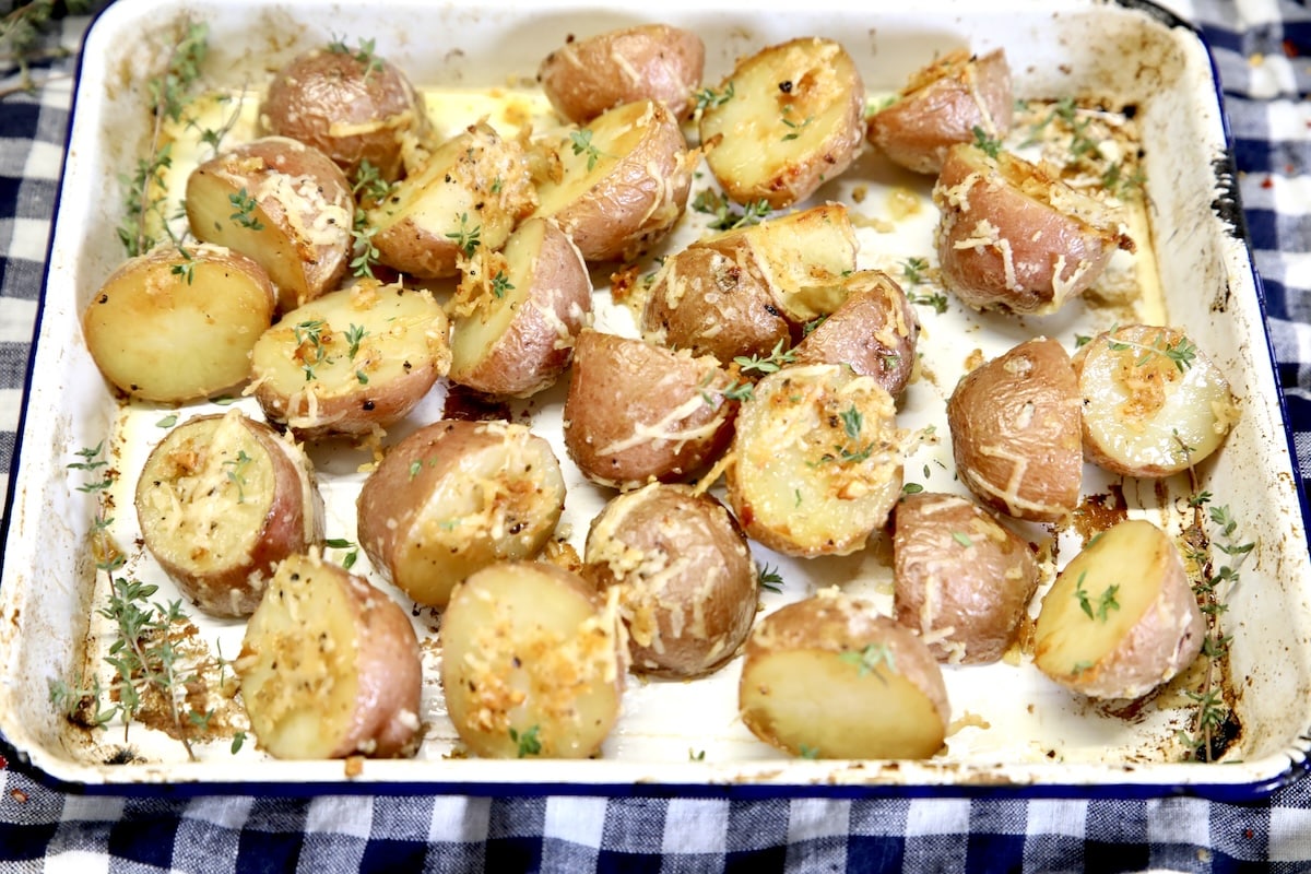 Pan of roasted potatoes with parmesan, garlic and herbs.