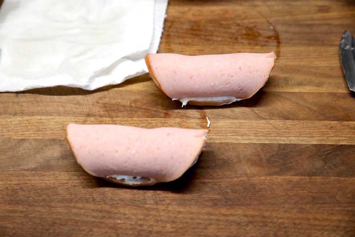 Bologna rolled up with pickle in middle.