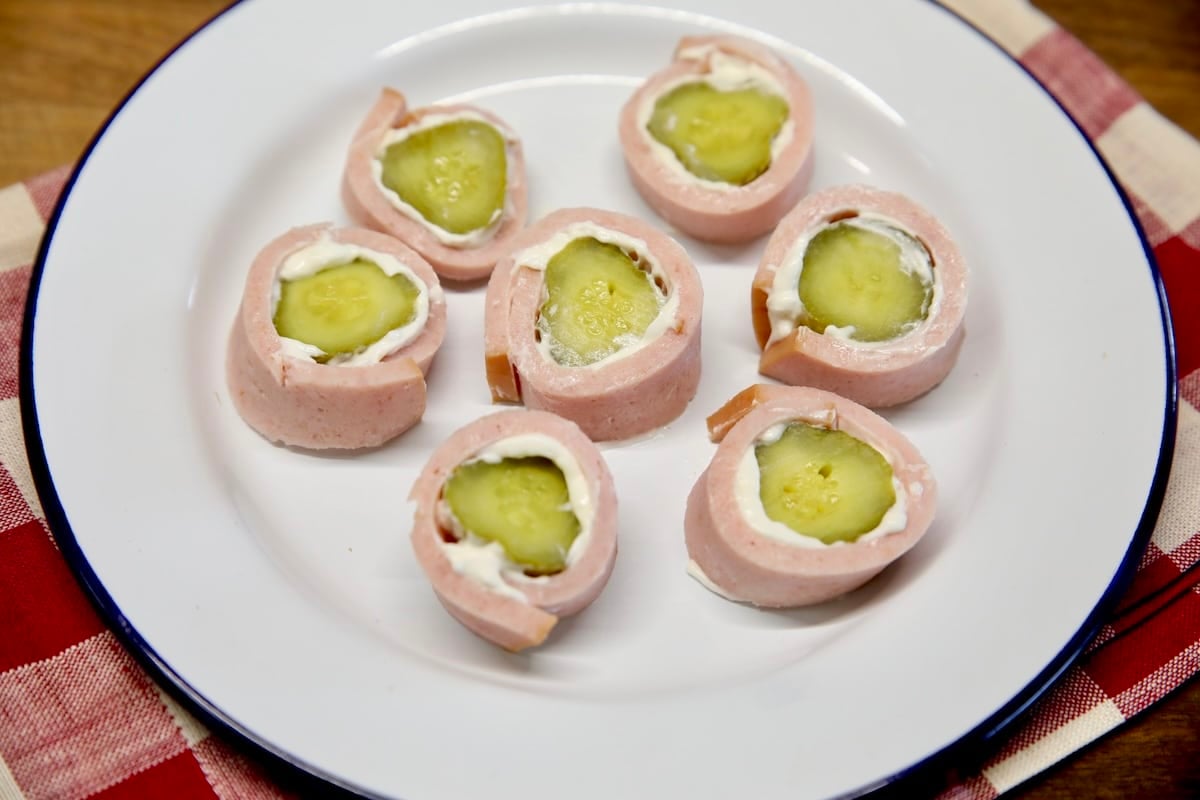 Bologna pickle roll ups appetizer. Plate of bologna pickle roll ups.