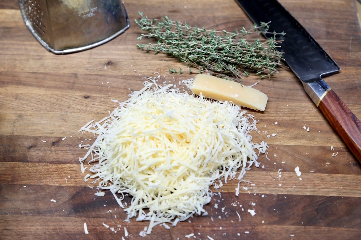Grated parmesan with fresh thyme.