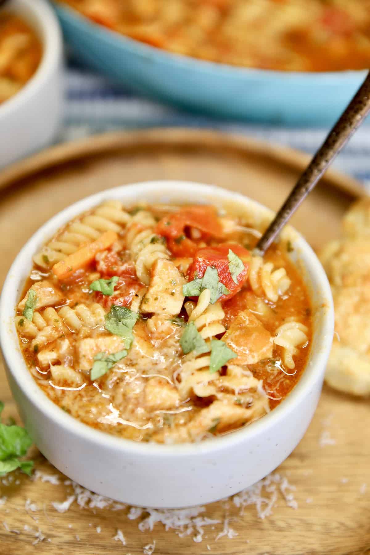 Bowl of chicken parmesan soup.