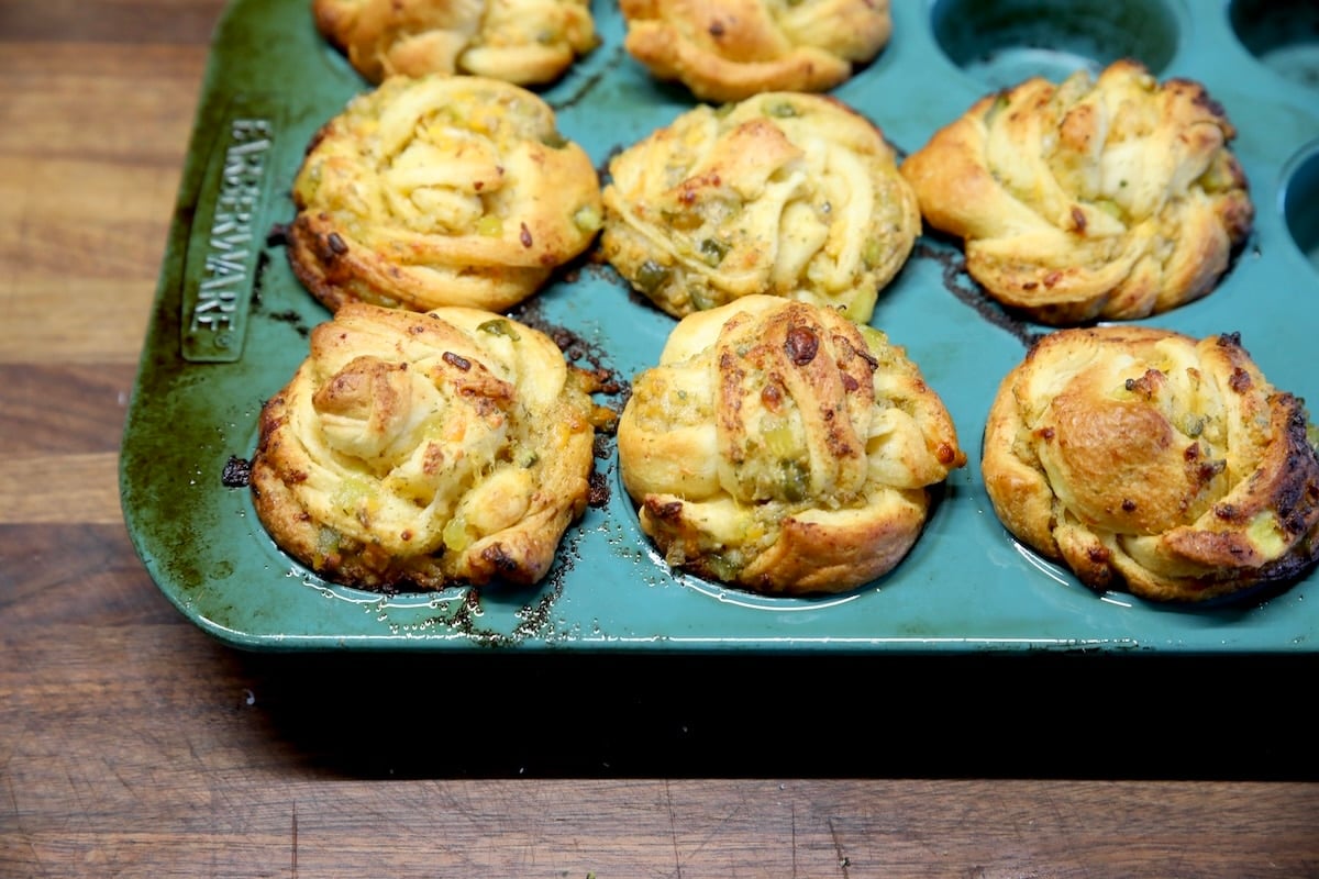 Pickle cruffins in a muffin tin.