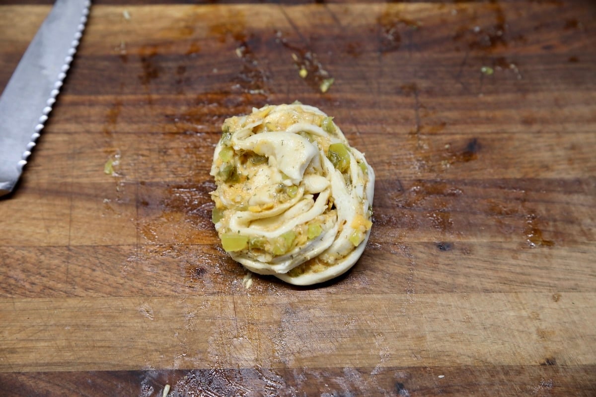 Roll up crescent dough muffin with pickle filling.