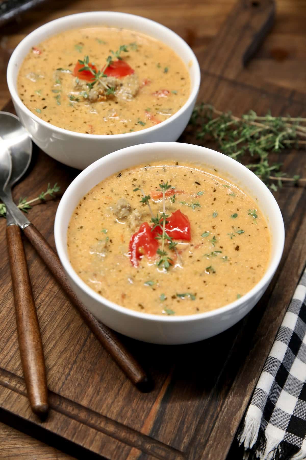 Creamy tomato sausage soup in 2 bowls.