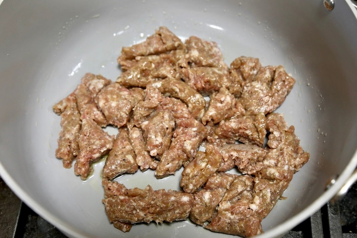 Italian sausage in a pan.