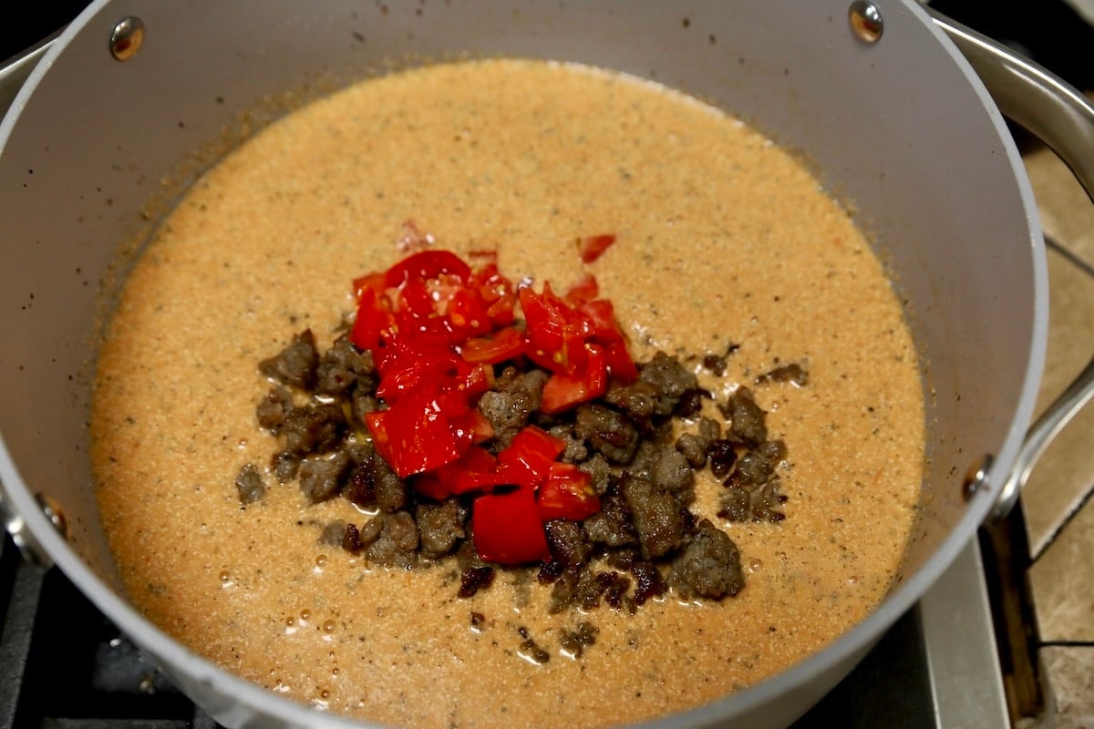 Creamy tomato soup with sausage and fresh tomatoes.