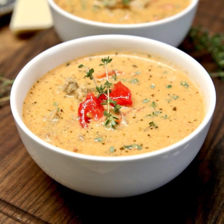 Bowl of creamy tomato sausage soup.