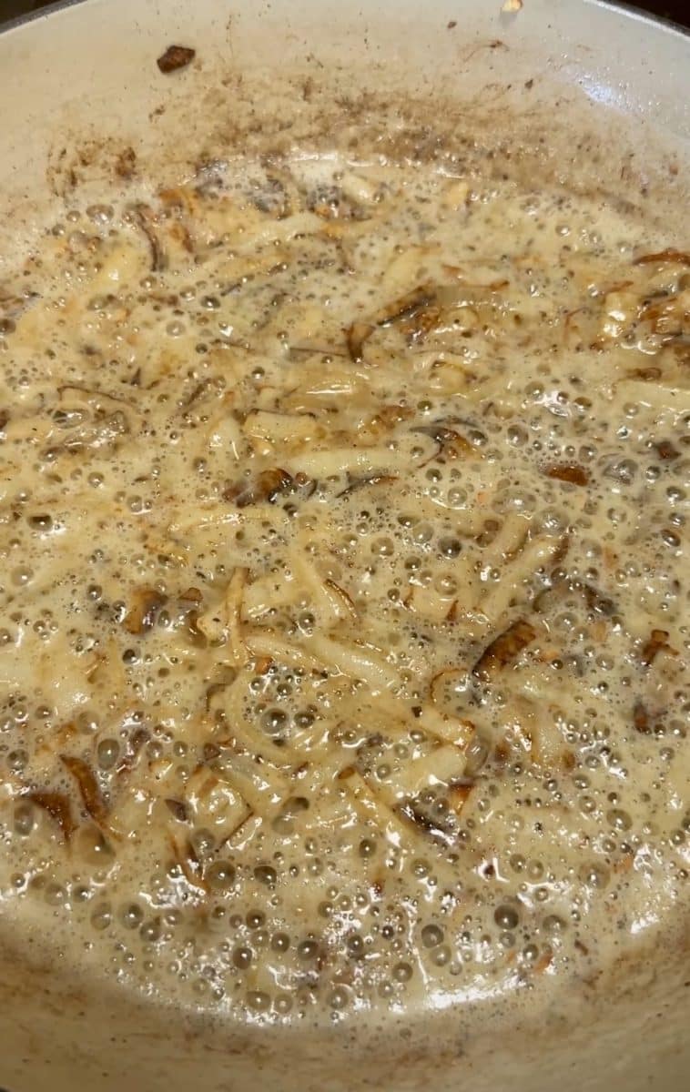 Browning flour in a skillet.