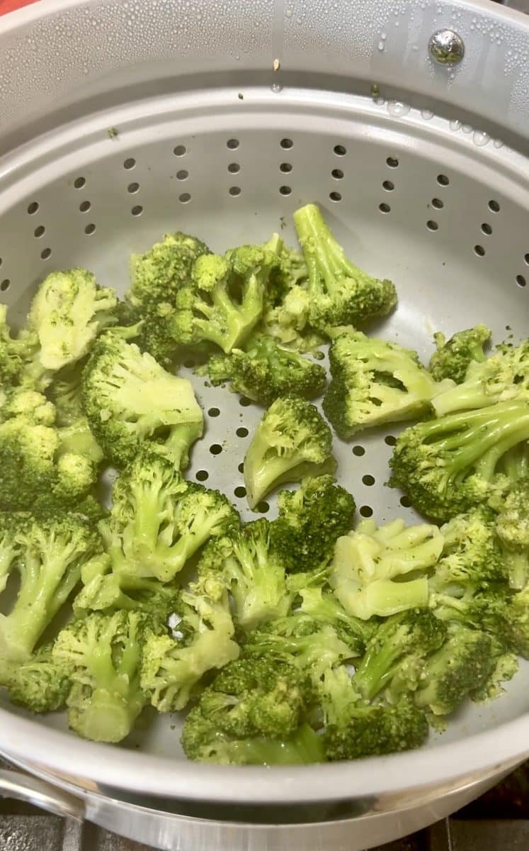 Steaming broccoli florets.