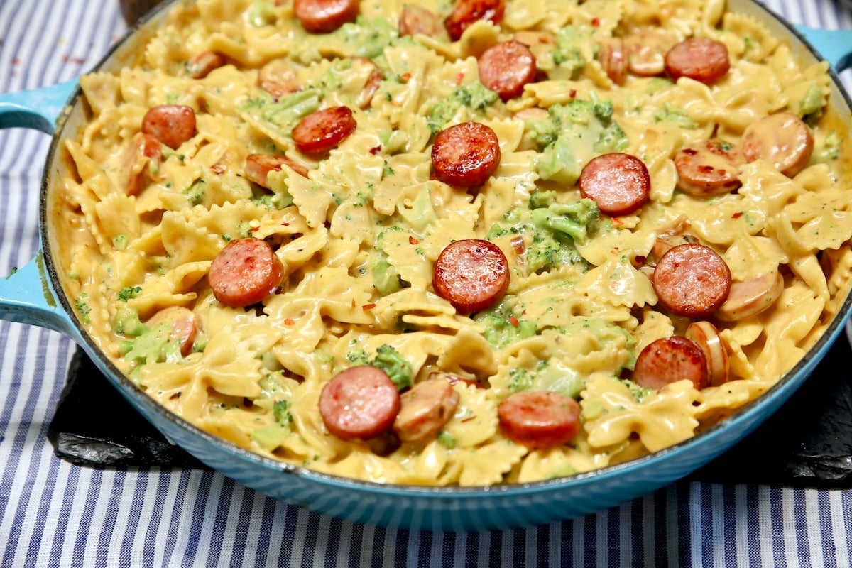 Pan of smoked sausage cheddar pasta.